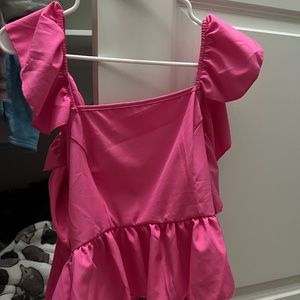 Hot pink ruffle with crossed back tank top